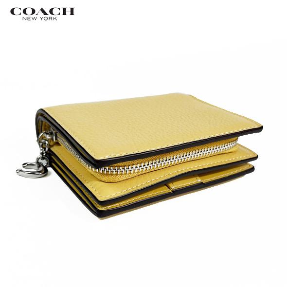 新品・未使用COACH チャーリーブラウン 二つ折り財布コーチ黄色イエロー 新品・未使用COACH チャーリーブラウン 二つ折り財布コーチ黄色
