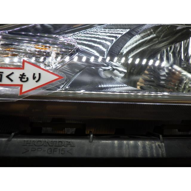 フィット コーティング済 DAA-GP1 左ヘッドランプ/ヘッドライト  