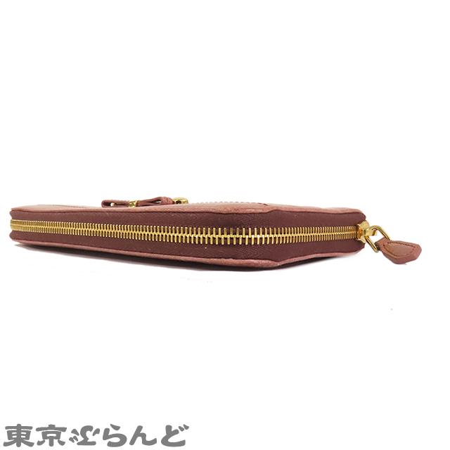 美品 プラダ ラウンドファスナー リボン 1M0506 レザー サフィアーノレザー ペオニア 1211 長財布【中古】PRADA PRADA - 美品 プラダ ラウンドファスナー リボン 1M0506 レザー