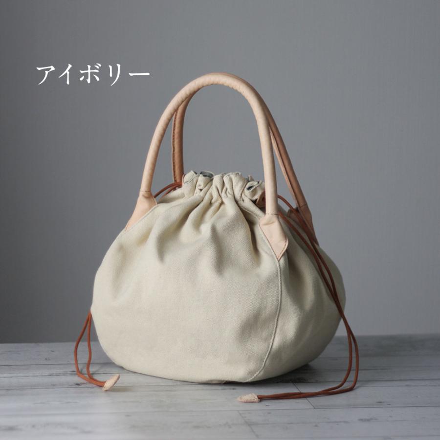30万くらいするハンドバック。 ほほ未使用です。 ハンドバッグ 本革×帆布 長財布も入るぽってり巾着バッグ レディース