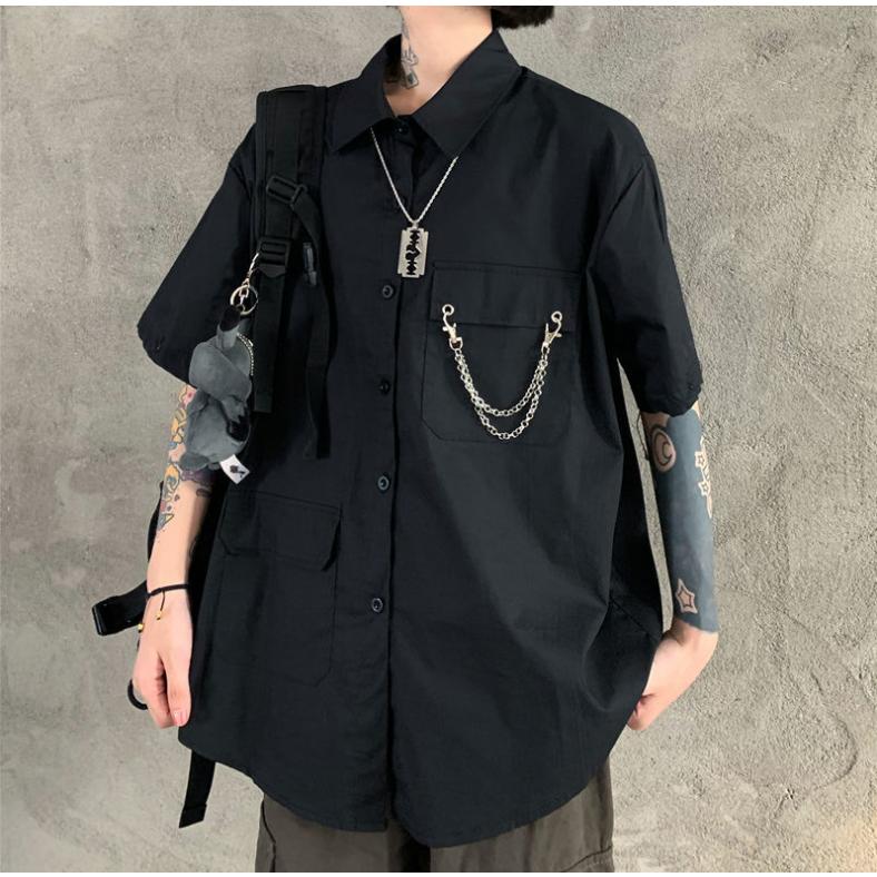 ノットコンベルショナル フリル付き黒シャツ モード ノットコンベルショナル フリル付き黒シャツ モード ノットコンベル