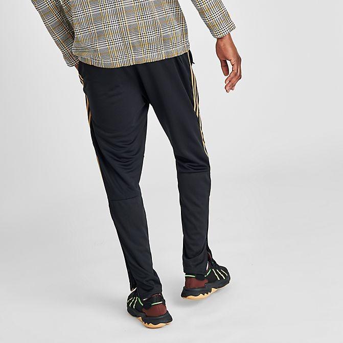 black and gold tiro pants