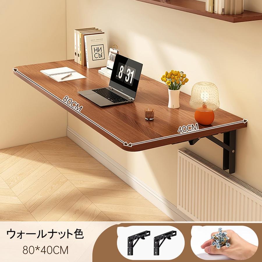 壁に突っ張り棒で固定するタイプの折り畳みテーブルです。 壁に取り付けられた 折りたたみ式テーブル 折り畳みテーブル
