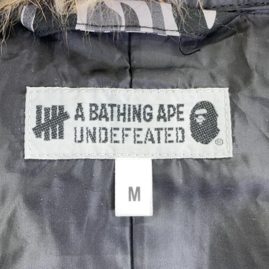 A BATHING APE アベイシングエイプ ×UNDEFEATED カモフラ M-51 モッズコート ブラック×グレー コート コットン メンズ 中古の画像