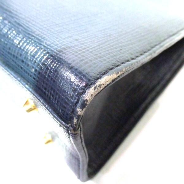 未使用保管 2151 courreges ハンドバッグ レザー ロゴ型押し 紺色 未使用保管 2151 courreges ハンドバッグ レザー ロゴ型押し