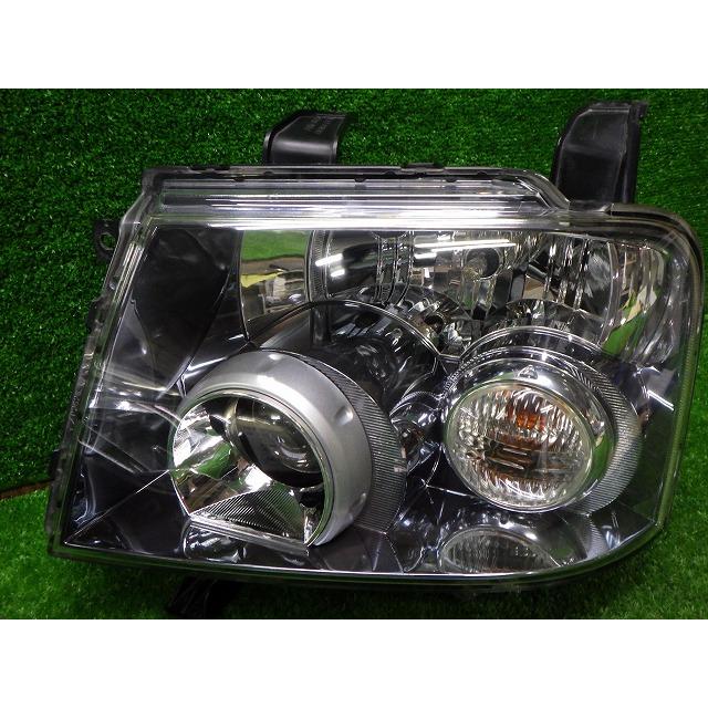 三菱（MITSUBISHI） EKスポーツ 左ヘッドライト HID H81W P3247 D