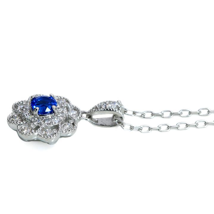 アウイナイト0.10ct 上質のラウンドカット ダイヤでフラワーを描く取り巻き 濃厚コバルトブルー・ドイツの稀少石 PTペンダントネックレス 受注可の画像