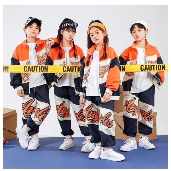 ガールズヒップホップ ダンス衣装 キッズ セットアップ 派手 へそ出しトップス ショートパンツ シースルー K-POP 韓国 オレンジ 黒 フラッグチェックの画像