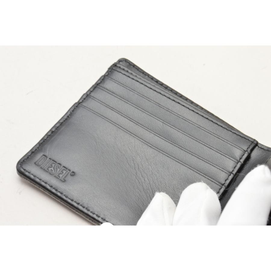 未使用★DIESELディーゼル 黒 エンボス立体ロゴ ラウンドファスナー折り財布 DIESEL - ディーゼル DIESEL 黒 エンボス立体ロゴ 折り財布 USED